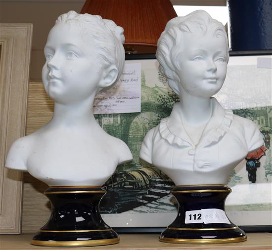 A pair of French Tharaud Limoges busts of children 40cm.